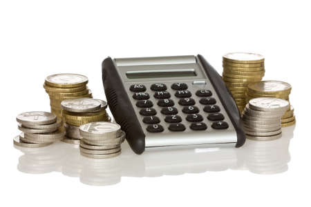 calculator and stack of coins with reflection on white backgroundの写真素材