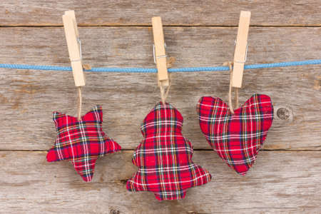 Christmas decoration hang over a wooden background の写真素材