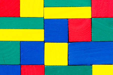Colorful wood texture made of small toy blocks 