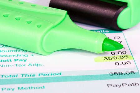  Payslip with monthly wage and green markerの写真素材