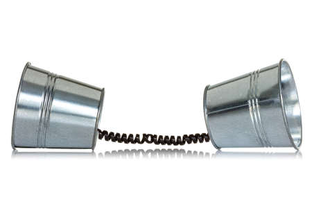 Two cans with telephone cord on a white background の写真素材