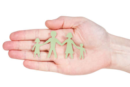 Paper family in hand isolated on white background の写真素材