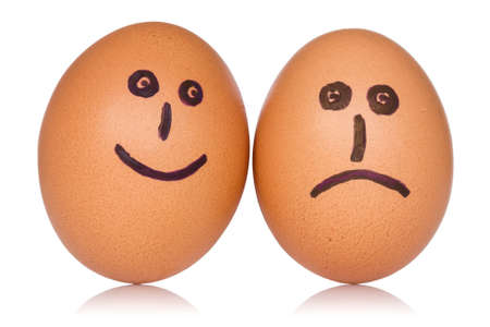  Happy and angry eggs over a white backgroundの写真素材