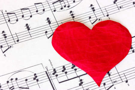 Red paper heart on the sheet musicの写真素材