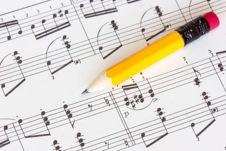 Sheet of musical notes with yellow pencilの写真素材
