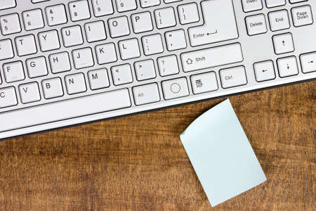 Computer keyboard and blank memo. Can be used for your text