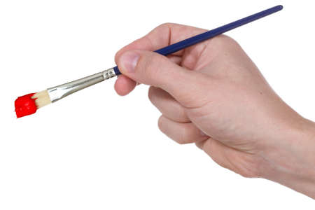 Hand with paintbrush isolated on white backgroundの写真素材