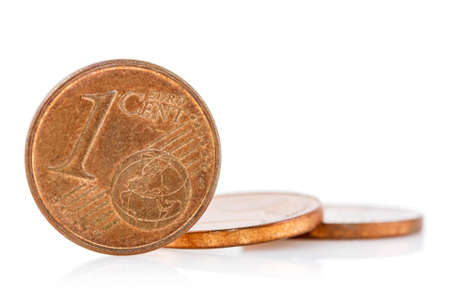 Bronze Euro Cent coins with reflection on white backgroundの写真素材