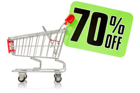 Shopping cart with green sale tag. Isolated on white の写真素材