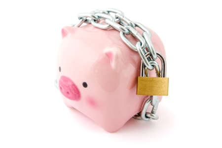 Piggybank chained up and locked. Concept for financial protection inferences or other investment messages. の写真素材