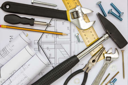 Construction tools and blueprints for a new house projectの写真素材