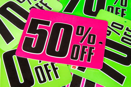 Lots of colorful sale tags lying on the surface 