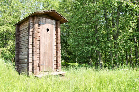 Old wooden outhouse for tourists at a forest の写真素材