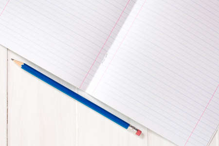 Blank sheet of lined notebook with pencilの写真素材