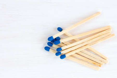 Matches on white wooden background with copy spaceの写真素材