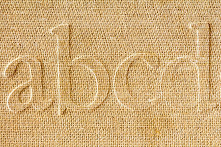 Alphabet printed on a background of  old paper,extreme close-upの写真素材