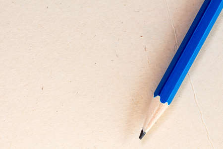 Paper background with pencil on right side and empty place for textの写真素材