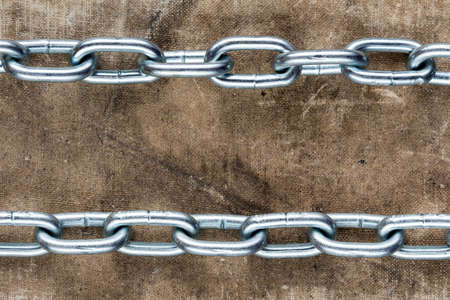 Two chains crossing old book cover, with copy spaceの写真素材