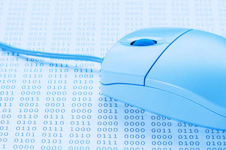 Computer mouse on binary code background. Blue tone imageの写真素材