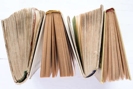 Top view of  four hardback books in a row.  Education background.の写真素材