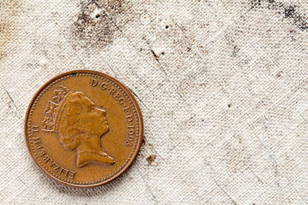 One penny on canvas background with copy - spaceの写真素材