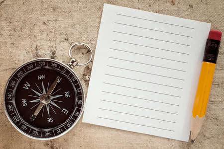 Old compass,pencil and blank paper for your textの写真素材