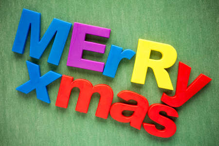 Merry xmas written in a colorful plastic lettersの写真素材