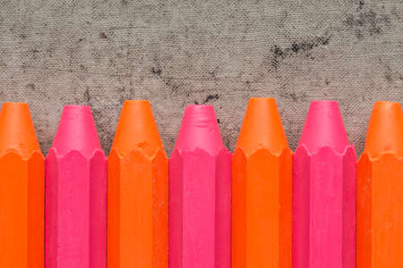 Vivid color crayons on the old dirty backgroundの写真素材