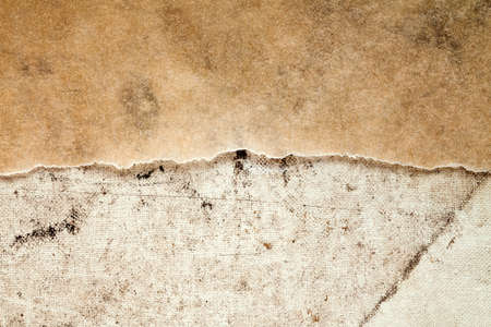 Old paper and dirty canvas - perfect background with copy-spaceの写真素材