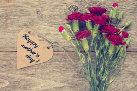 Heart shaped mothers day card with carnations bouquetの写真素材