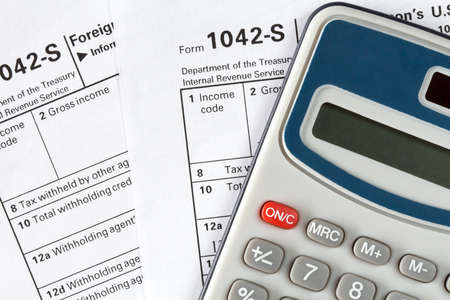 Filling out the form 1042-s which confirms the payment of the tax in the United States
