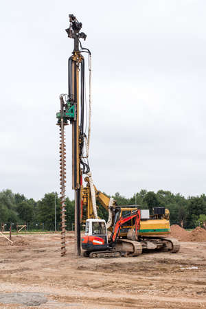 Machine for drilling holes in the ground