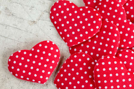 Decorative hearts pile on dirty canvas backgroundの写真素材