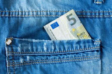 Brand new five euro in jeans pocketの写真素材