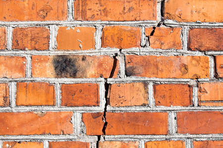 The crack in the brick wall. Image can be used as a background.の写真素材