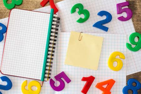 Squared exercise book,personal organizer,colored numbers and blank sticky noteの写真素材
