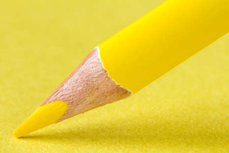 Yellow pencil on paper close-up. Business or education concept.の写真素材