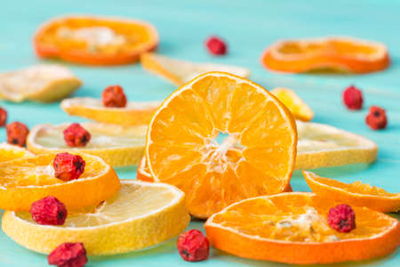 Sliced citrus fruits and rowan berry close upの写真素材