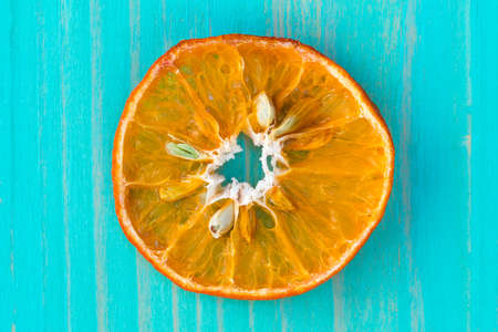Dry orange fruit on the blue wooden backgroundの写真素材