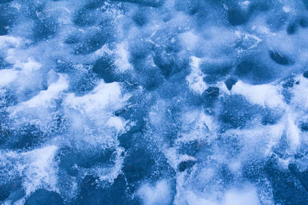 The blue ice surface with natural patterns