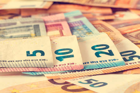 Close-up of various Euro banknotes, filtered image.の写真素材