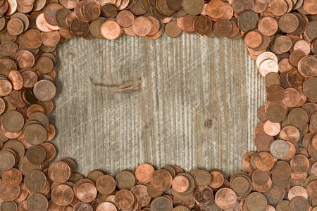 Frame from Euro cents with copy-space on wooden backgroundの写真素材