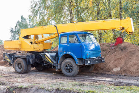 Yellow mobile crane on construction siteの写真素材