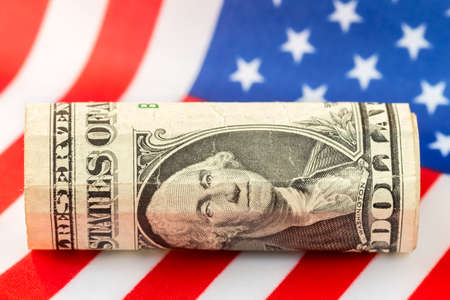 One Dollar over the flag of the United Statesの写真素材