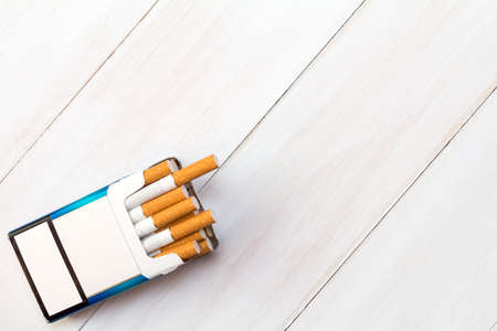 Pack of cigarettes with cigarettes sticking outの写真素材