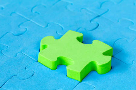 Jigsaw puzzle close-up. Stand out from the crowd conceptの写真素材