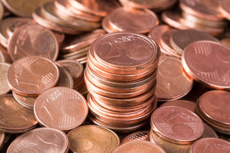Business and money saving concept - close up of euro cents