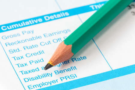 The income statement and pencil close-upの写真素材