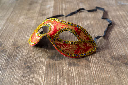 Carnival Venetian mask on the wooden tableの写真素材
