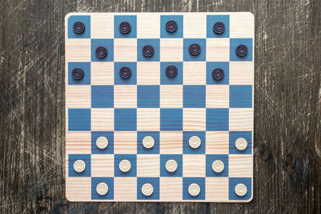 Checkers in checkerboard redy for playing. Game concept. Board game.